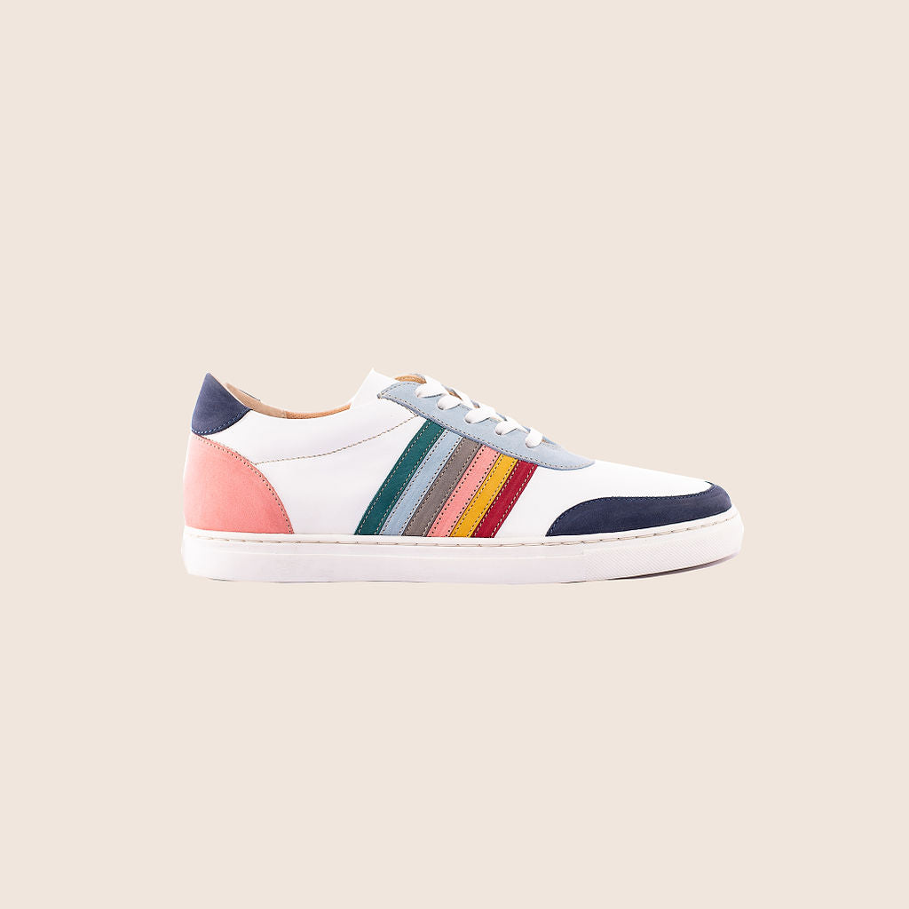 Maximallist sneaker in white milled leather, suede side straps and royal soles.