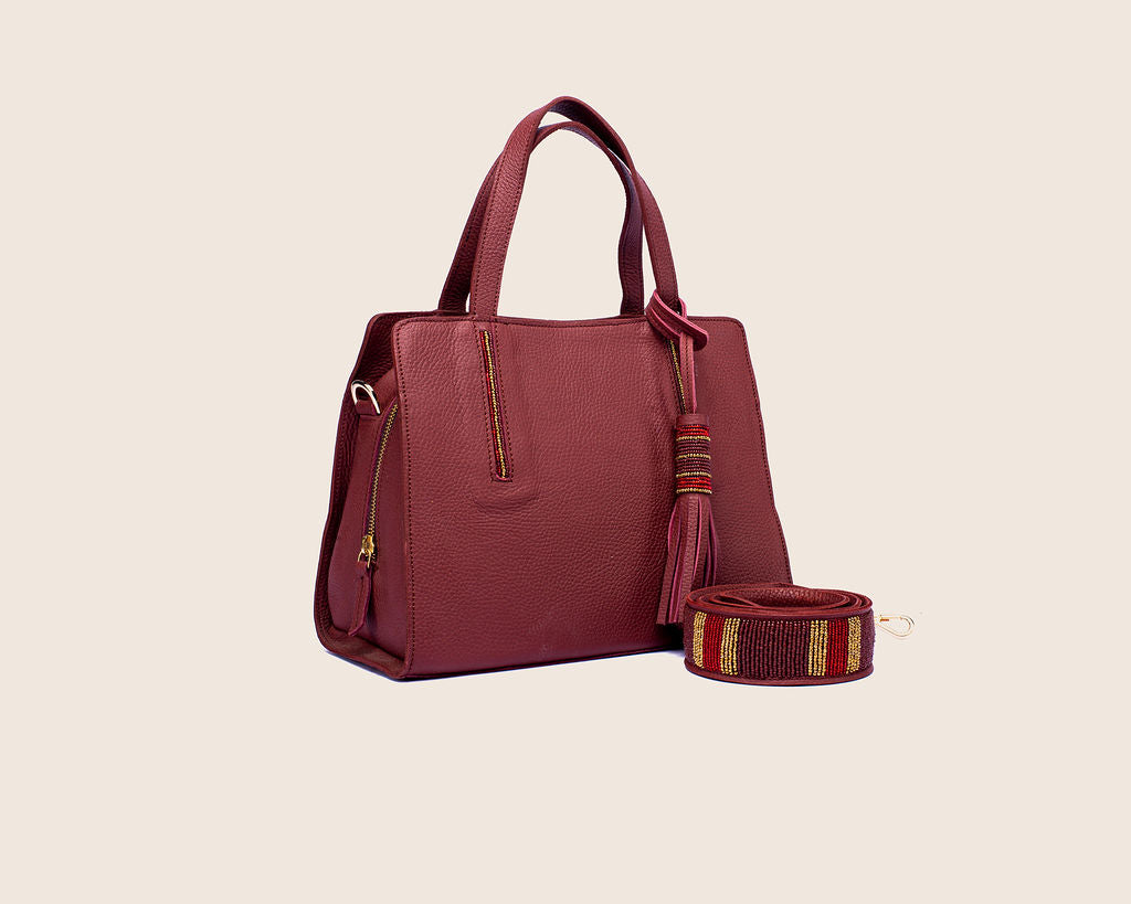 Kate bag in firebrick milled leather and with Maasai beaded strap.