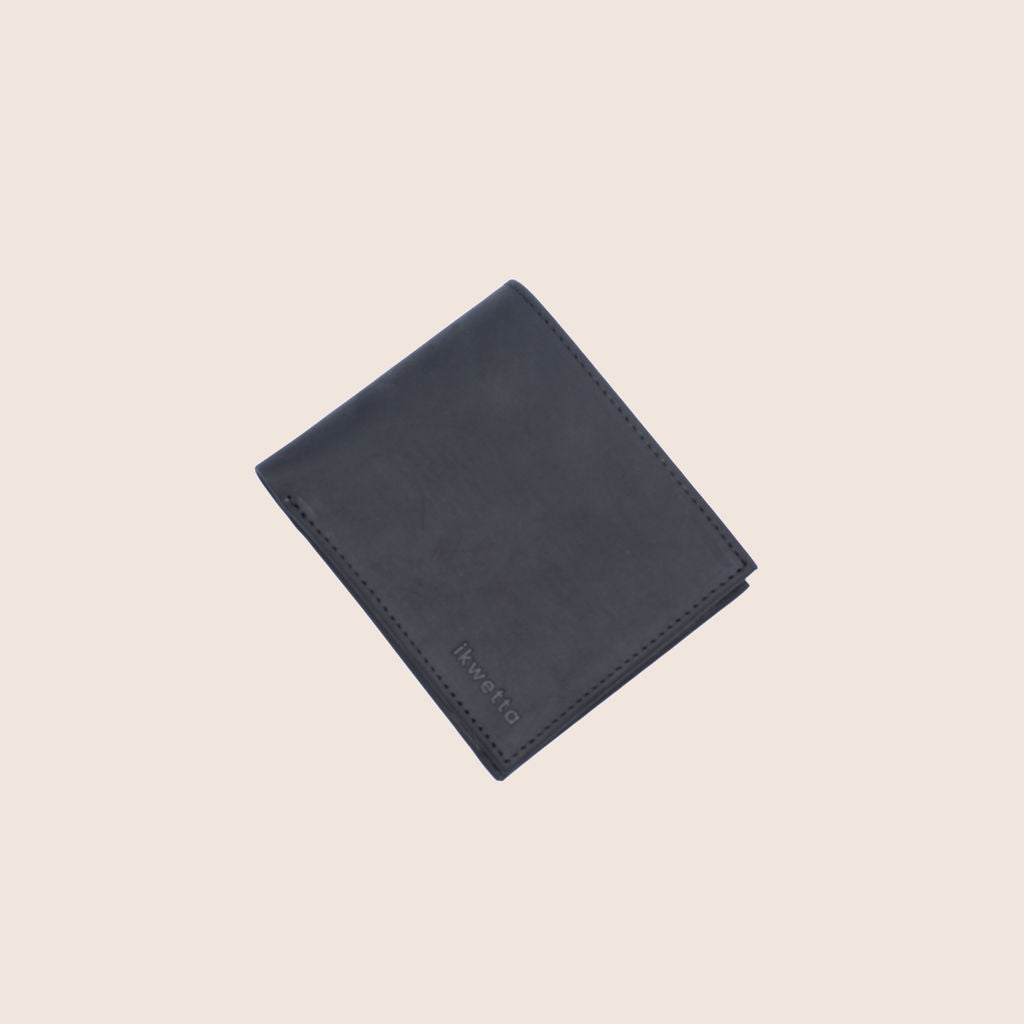 A wallet with a coin pouch inside.